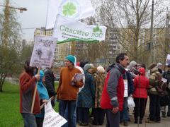Protest rally against Bitsevsky forest deforestation with people gathered and Alexey Ilvovsky speaking at microphone