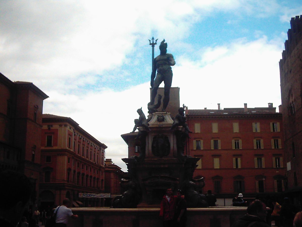 Fountain of Neptune in Bologna with blue sky background