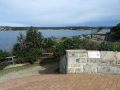 Bass and Flinders Point at Cronulla beach in New South Wales, Australia with clear blue water and rocky shoreline