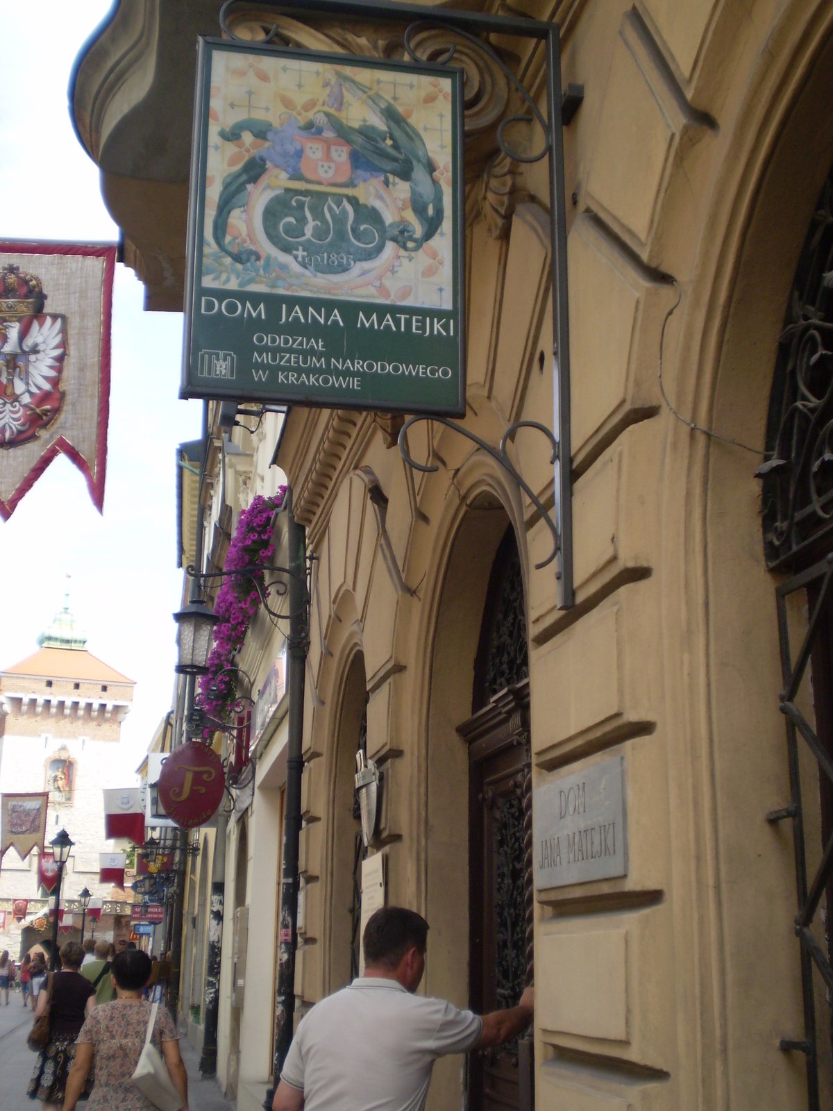 Floriańska Street in Kraków, Poland with historic buildings and street lamps