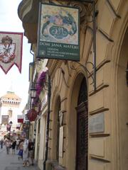 Floriańska Street in Kraków, Poland bustling with people and historic buildings