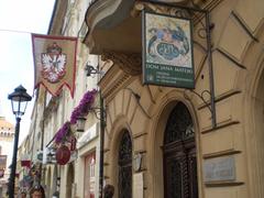 Floriańska Street in Kraków, Poland with historic buildings and pedestrians