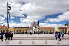 Praça do Comércio square with people walking and historical buildings in Lisbon, Portugal